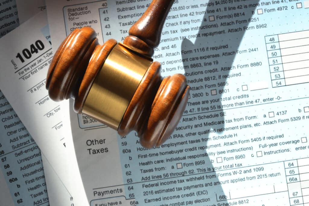 Tax Fraud vs. Tax Evasion (Explained) 